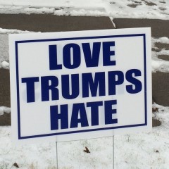 Village Life:  One sign leads to another, but does “Love Trump Hate”?