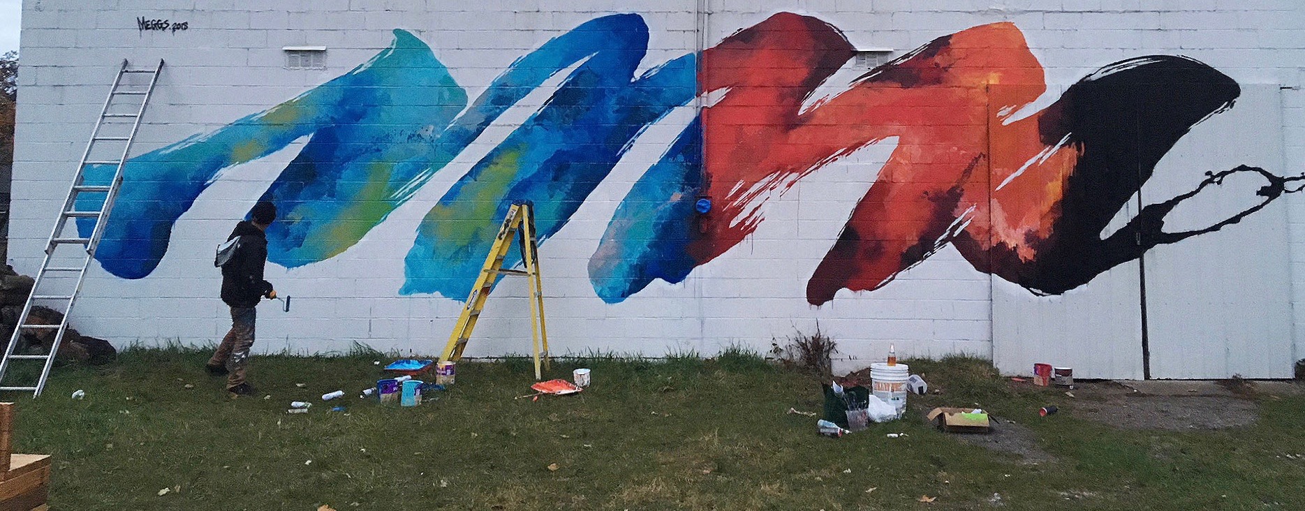 International and local artists collaborate to brighten bookstore’s walls, city’s image