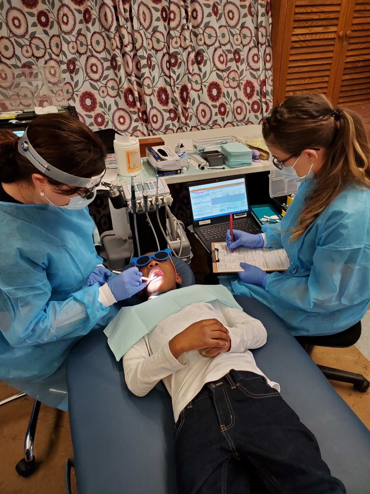 “SMILE” mobile dentists putting smiles on faces of Flint students and