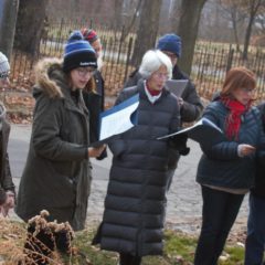 LGBTQ Choir honors John Bradford Bohl with Carriage Town caroling