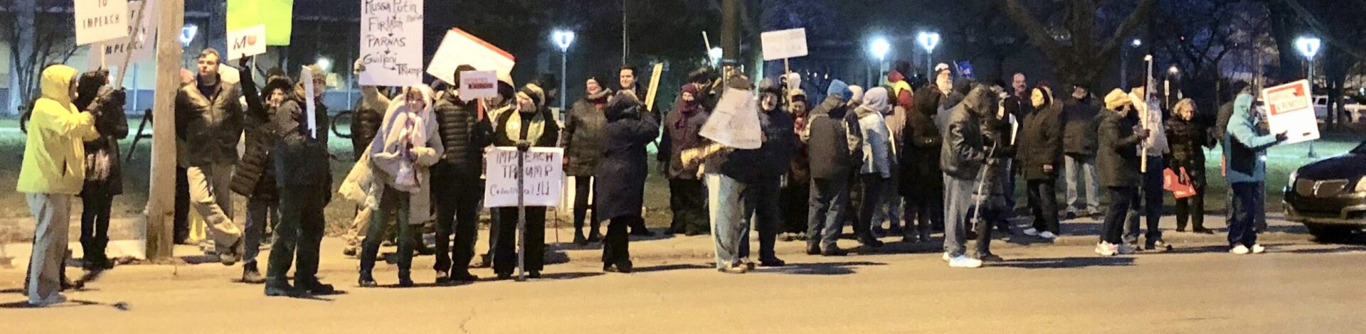 Downtown Flint “Impeach Trump” rally draws spirited protesters on cold night before the vote