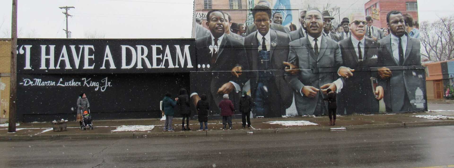 Small, spirit-filled MLK celebration led by local Baha’i group shines light on Peace Garden and new mural