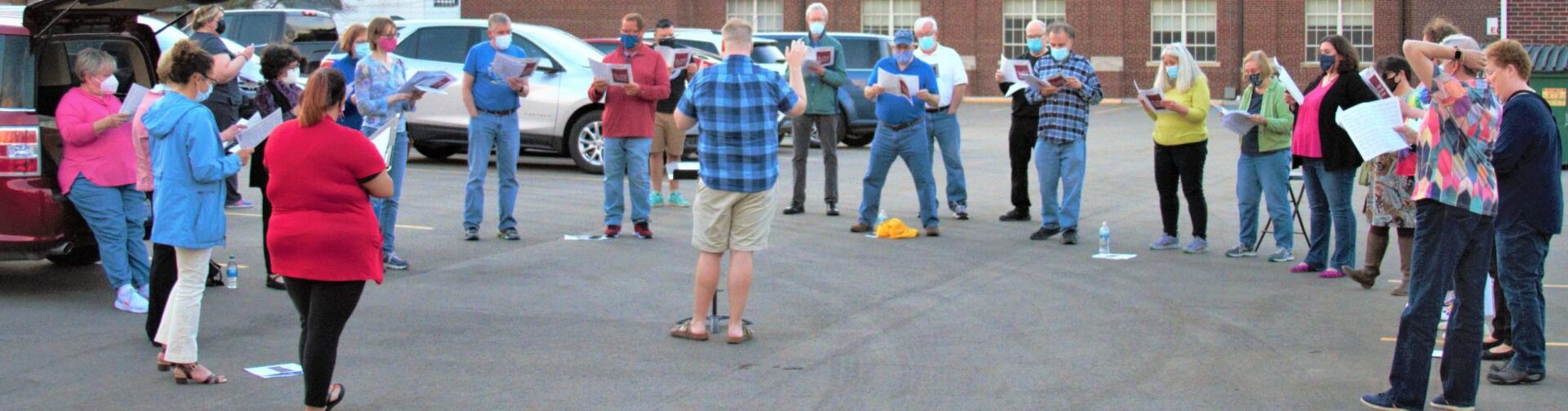 Harmonious voices rise from the parking lot: local choir meets to safely socialize and sing